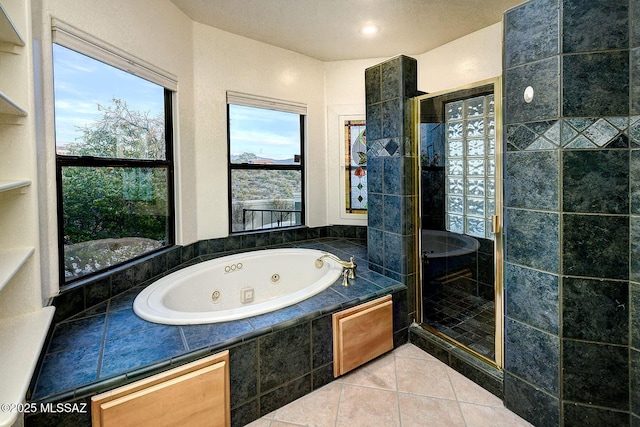 bathroom featuring tile patterned flooring and independent shower and bath