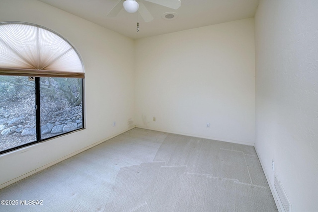 unfurnished room featuring carpet and ceiling fan