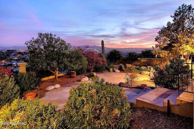 view of patio terrace at dusk