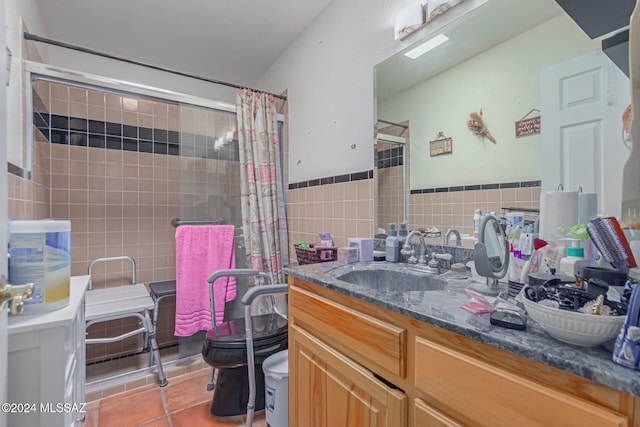 bathroom featuring tile patterned floors, a shower with curtain, vanity, tile walls, and toilet