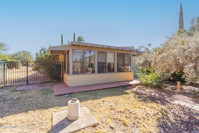 view of property exterior with a yard and a wooden deck