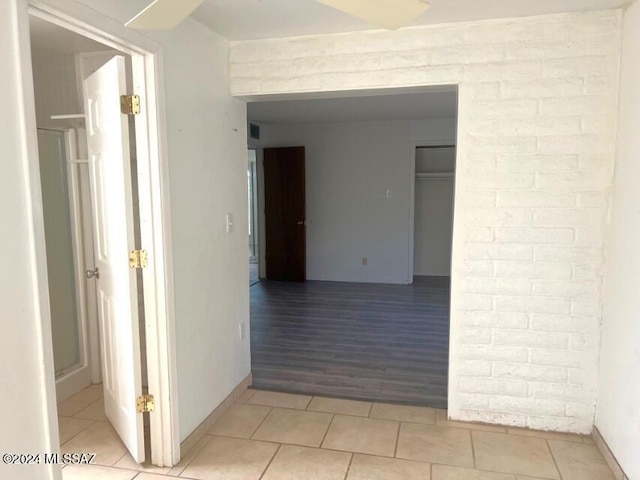 hall featuring light tile patterned floors