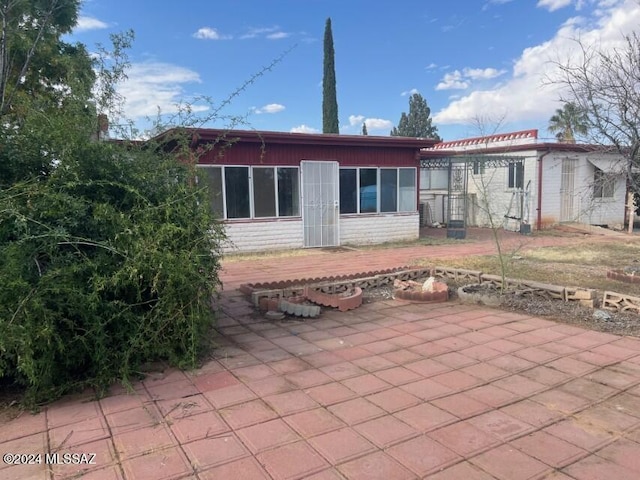 rear view of property with a patio area