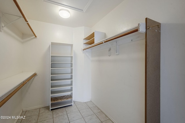 spacious closet featuring light tile patterned flooring