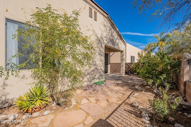 view of home's exterior with a patio area