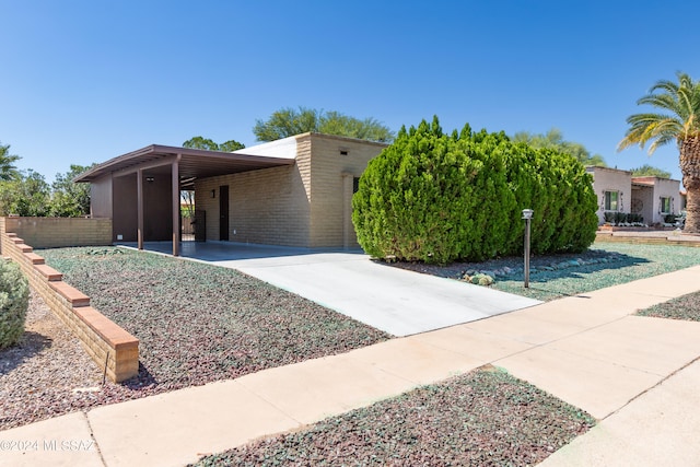 view of front of home with a carport