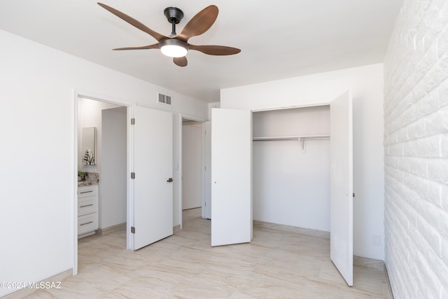 unfurnished bedroom featuring ceiling fan and a closet