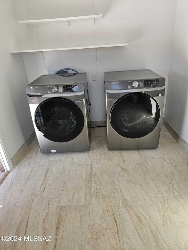 laundry room with washer and clothes dryer