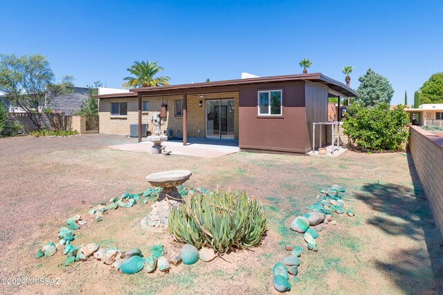 rear view of house with a patio