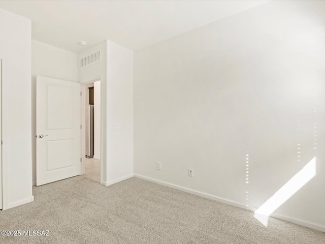 unfurnished bedroom featuring light colored carpet