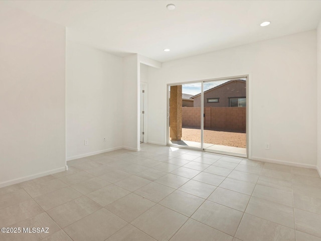 empty room with light tile patterned floors