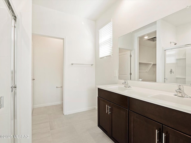 bathroom with vanity and walk in shower