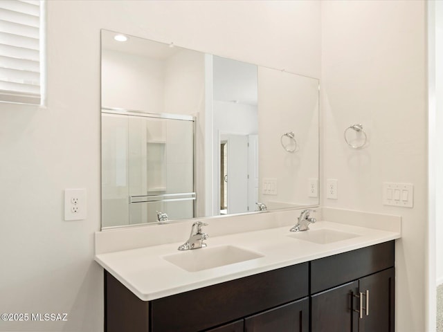 bathroom featuring vanity and walk in shower