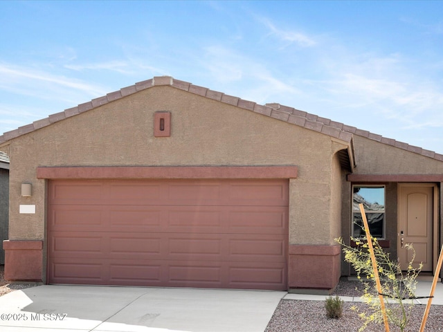 pueblo-style home featuring a garage