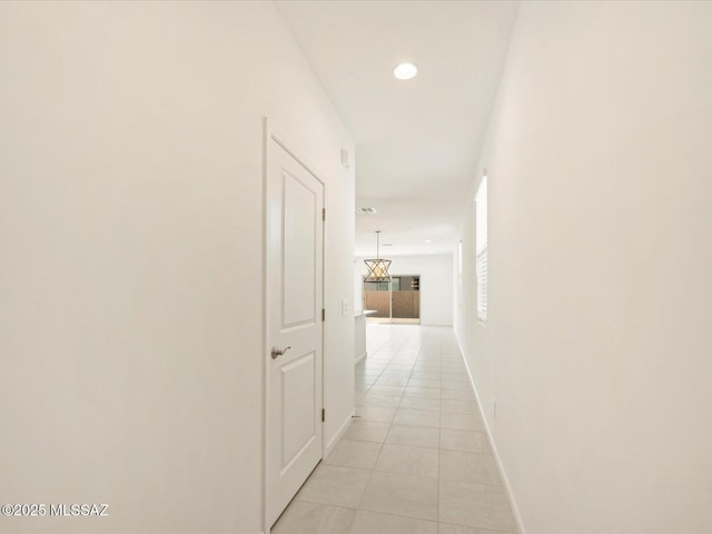 corridor with light tile patterned floors