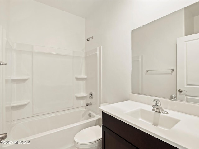 full bathroom featuring shower / bath combination, vanity, and toilet