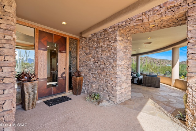 view of exterior entry with a mountain view