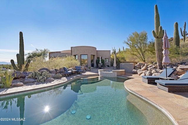 view of pool featuring an in ground hot tub and a patio