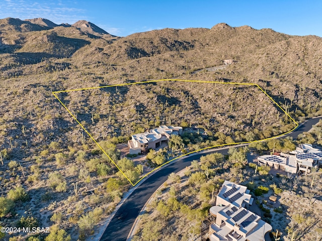 birds eye view of property with a mountain view