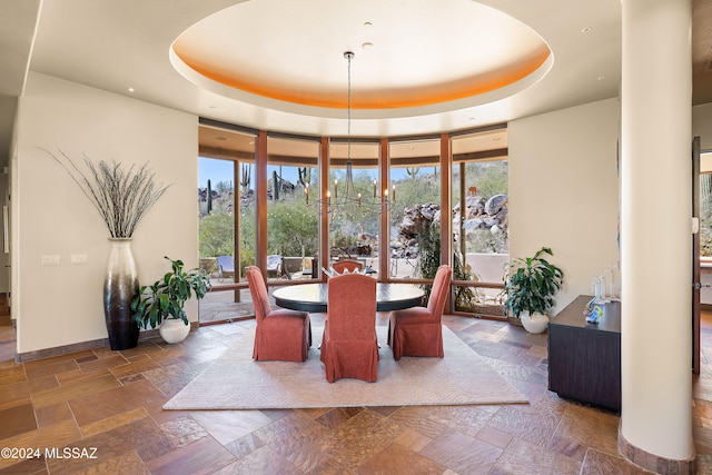 dining area featuring a tray ceiling