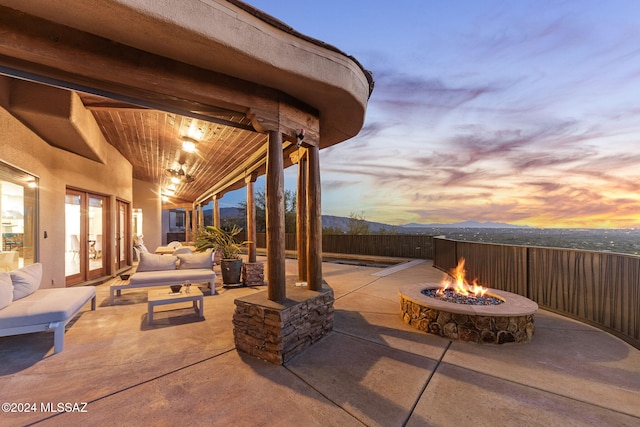 patio terrace at dusk with a fire pit