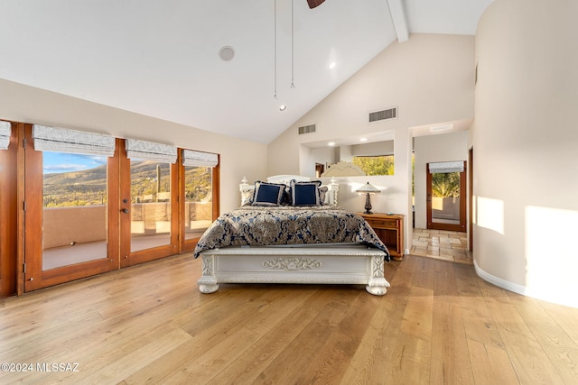 bedroom with beam ceiling, access to exterior, high vaulted ceiling, and light wood-type flooring