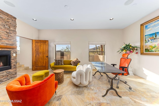 interior space featuring a stone fireplace