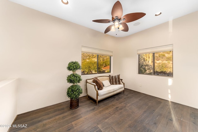 sitting room featuring ceiling fan and dark hardwood / wood-style floors