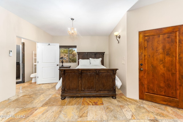 bedroom with a notable chandelier