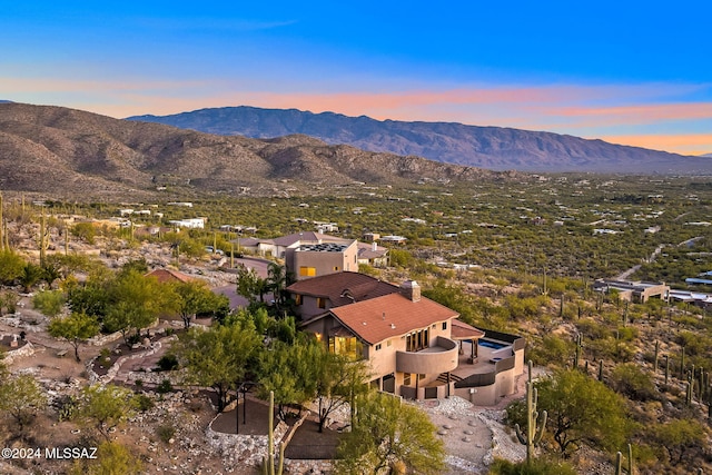 aerial view at dusk with a mountain view