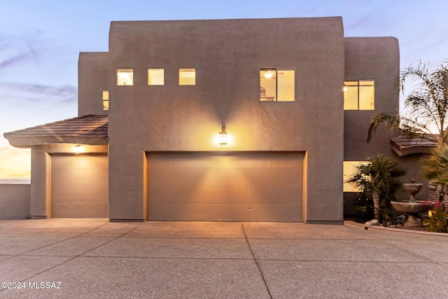 view of front of property with a garage