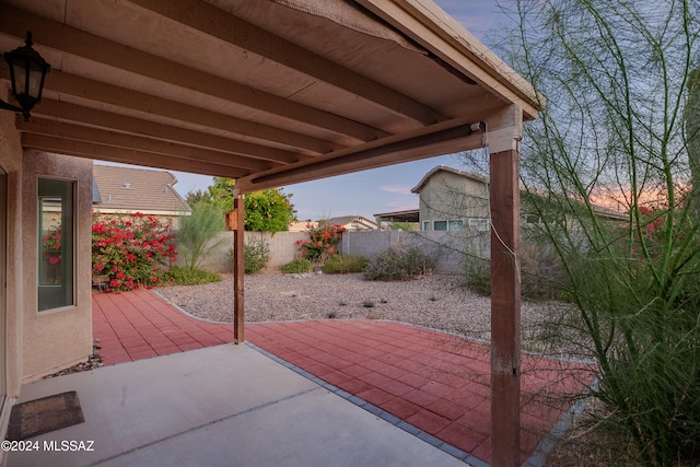 view of patio terrace at dusk