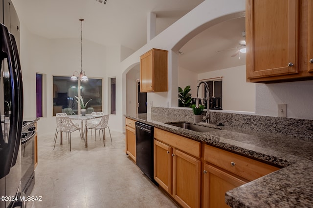 kitchen with pendant lighting, high vaulted ceiling, black appliances, ceiling fan with notable chandelier, and sink