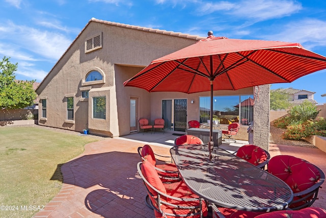 view of patio featuring outdoor dining area and fence