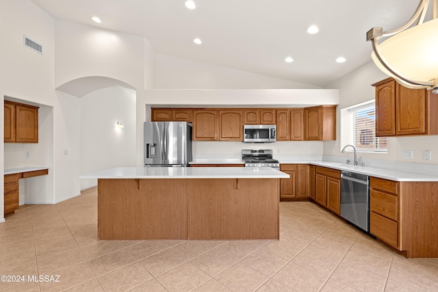 kitchen featuring visible vents, a sink, appliances with stainless steel finishes, light countertops, and light tile patterned floors