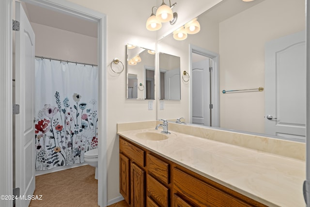 full bathroom featuring a shower with curtain, toilet, vanity, and tile patterned flooring