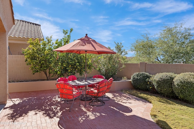 view of patio / terrace with outdoor dining area and fence