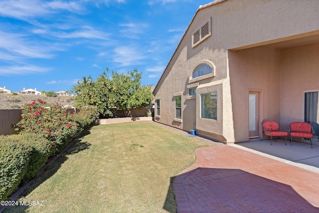 view of yard with a patio and a fenced backyard