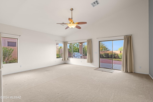 unfurnished room with visible vents, carpet flooring, high vaulted ceiling, and ceiling fan