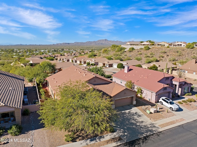 drone / aerial view featuring a residential view and a mountain view