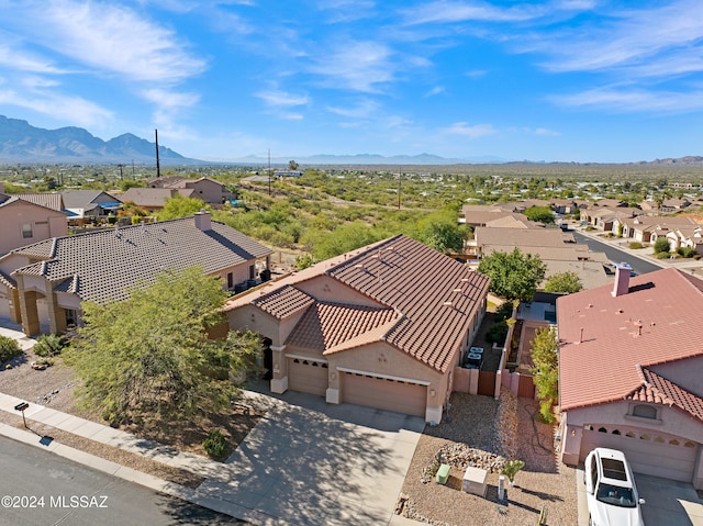 birds eye view of property featuring a mountain view and a residential view