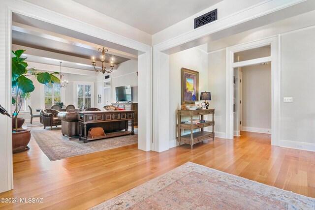 interior space featuring a chandelier and hardwood / wood-style flooring