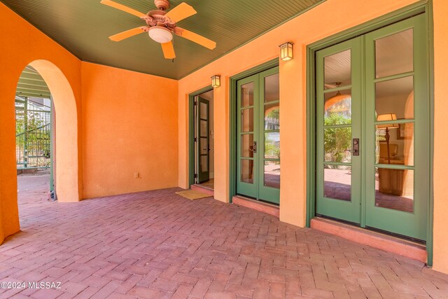 view of patio / terrace featuring ceiling fan and french doors