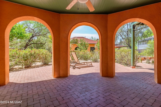 view of patio featuring ceiling fan