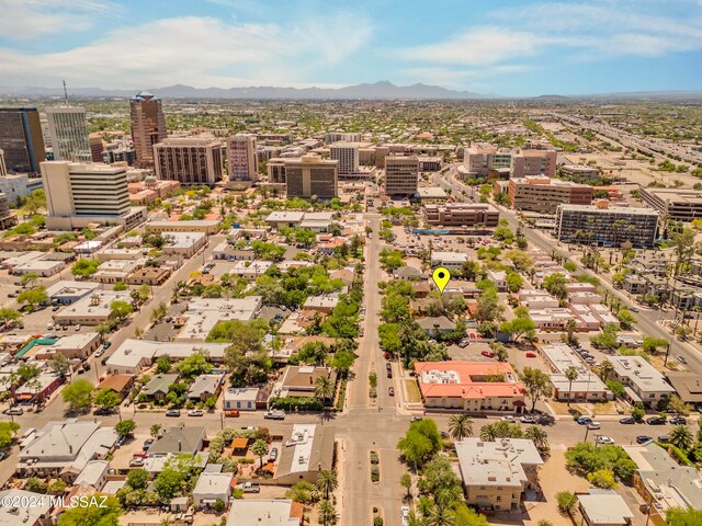 birds eye view of property with a mountain view