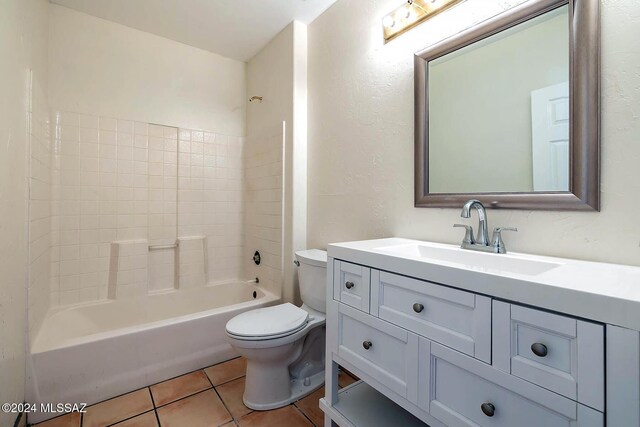 full bathroom featuring  shower combination, toilet, tile patterned flooring, and vanity