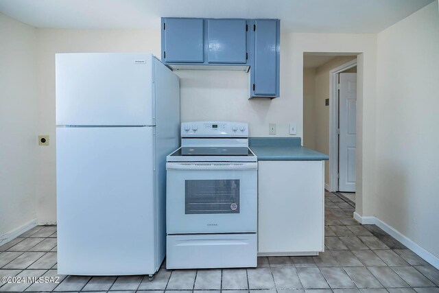 kitchen with electric stove, light tile patterned flooring, and sink