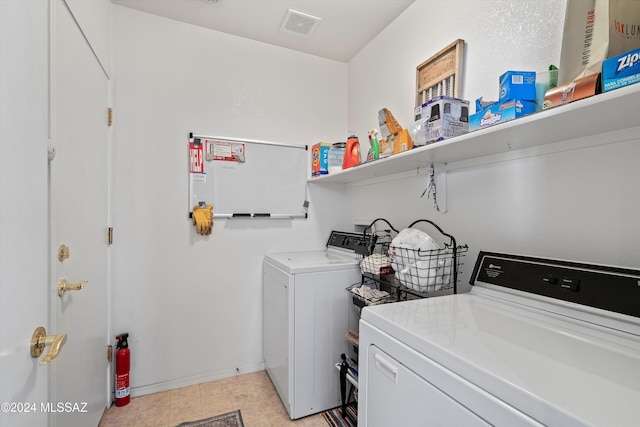 washroom featuring washing machine and dryer