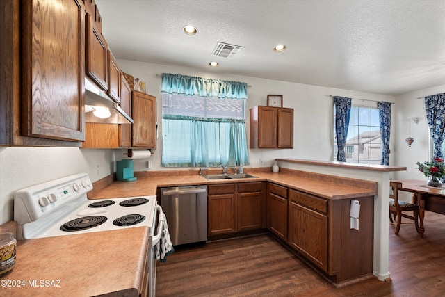 kitchen featuring white electric range oven, dark hardwood / wood-style floors, stainless steel dishwasher, and sink