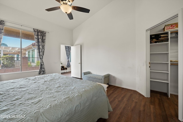 bedroom featuring dark hardwood / wood-style flooring, a closet, vaulted ceiling, and ceiling fan